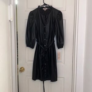 Nannette Lepore button down dress with belt and quarter length stretchy sleeves.